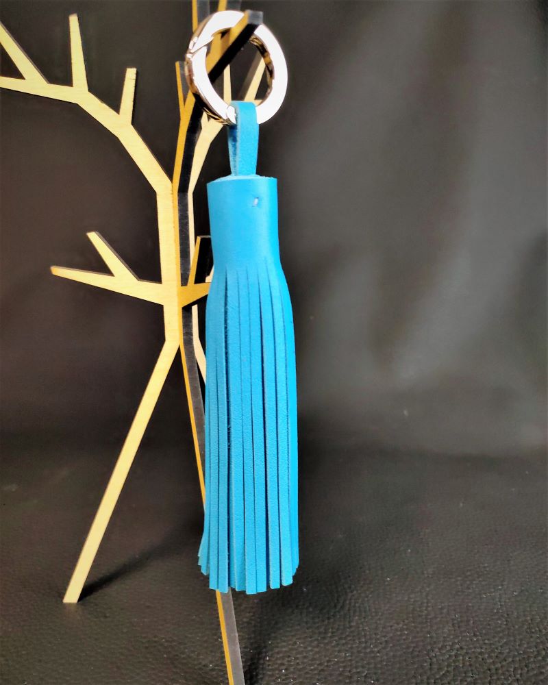 Pompon en cuir bleu turquoise un accessoire de sac à main bijou de sac