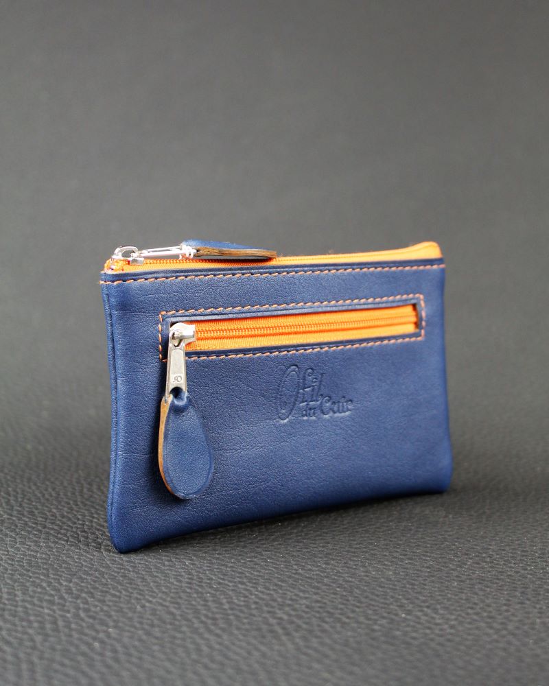 Porte monnaie en cuir bleu marine avec deux poches doublées en tissus africain et zip orange